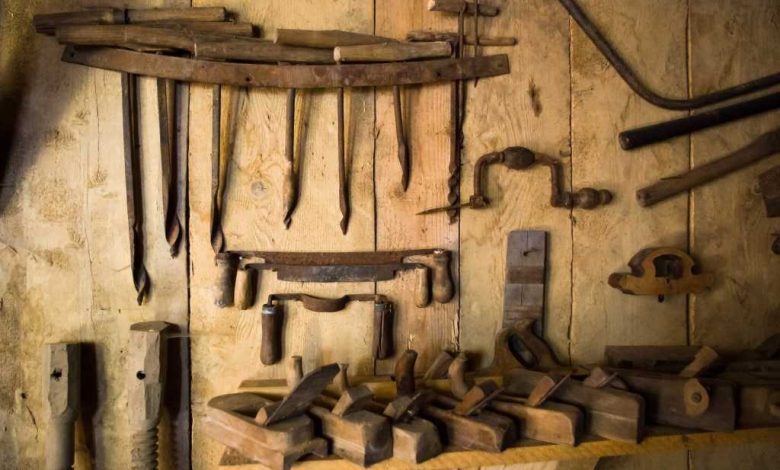 shutterstock 77260183 rusty old woodworking tools on the wall of an old workshop