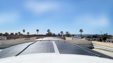 Merlin Solar panels sit on a curved roof.