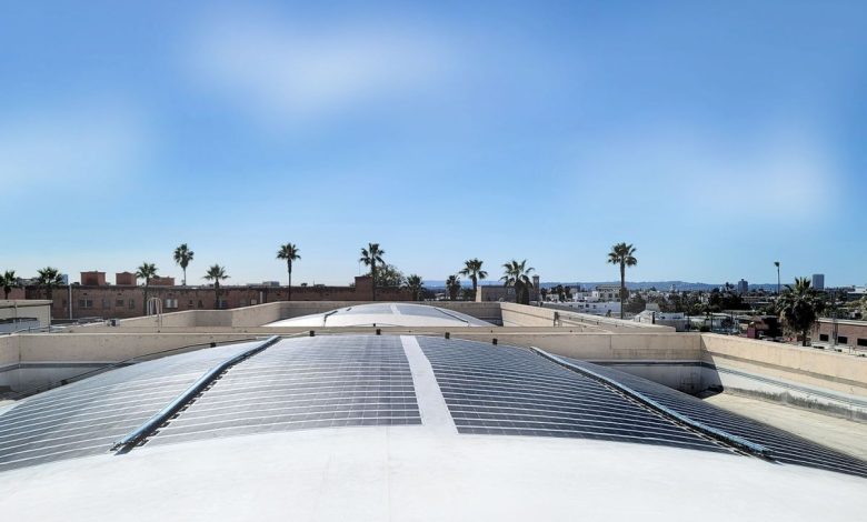 Merlin Solar panels sit on a curved roof.