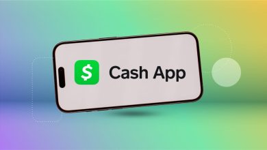 the Cash App logo on a smart phone in front of a blue, green and yellow multihued background