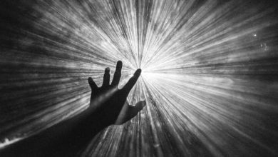 aspiration; vision; hand reaching for the light