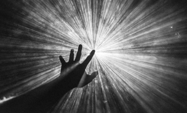 aspiration; vision; hand reaching for the light