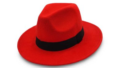 shutterstock 1395239159 red fedora hat with black band on white background red hat