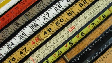 rulers measures measuring sticks of different colors placed side by side