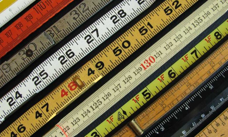 rulers measures measuring sticks of different colors placed side by side