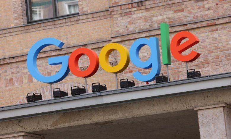 Google corporate logo hangs outside the Google Germany offices