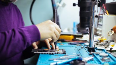 Technician repairing a smartphone.