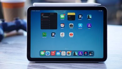 A 9th gen iPad on a wood table viewed from the top down