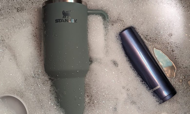 stanley cup and bottle soaking in water