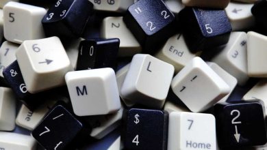 Black and white computer keyboard keys, mostly numeric with M and L (machine learning) keys in foreground. Concept of unstructured big data for data science and deep learning.