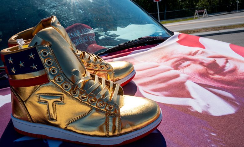 Image of Trump branded shoes on the hood of a car.