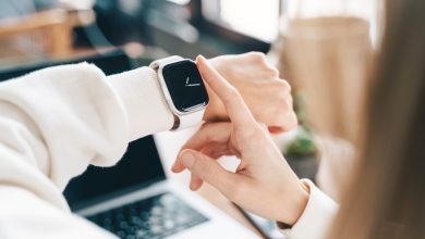 Modern woman using smart watch for daily tasks, interacting with the touchscreen user interface. Tracking health habits, messaging, checking on time with simple application software.