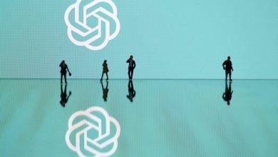 This photograph taken in Mulhouse, eastern France on October 19, 2023, shows figurines next to the ChatGPT logo. (Photo by SEBASTIEN BOZON/AFP via Getty Images)