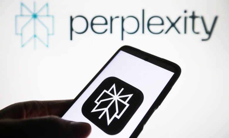 Perplexity AI logo is seen on a smartphone and on a PC screen.